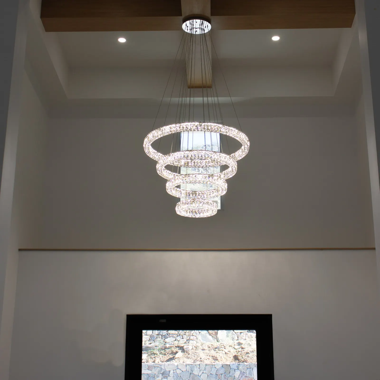 Entryway chandelier hung level in a custom home